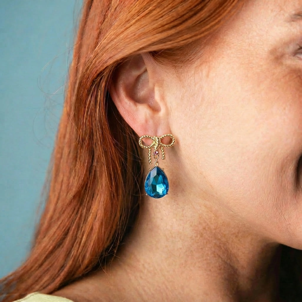 Gold Bow Earring with Blue Crystal Teardrop